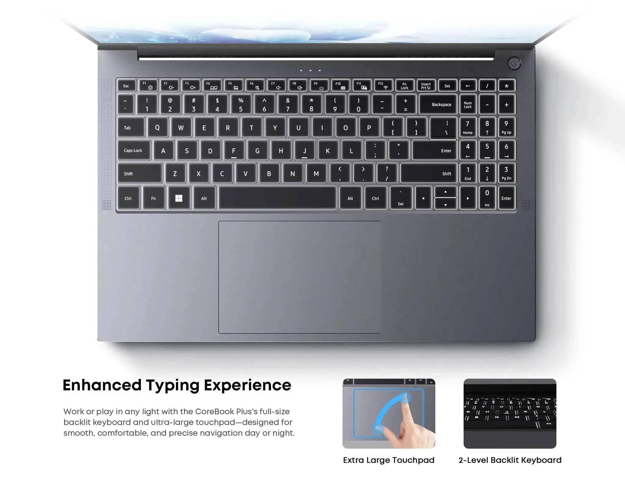 Laptop keyboard on a metal gray chassis with backlit keys and a large touchpad